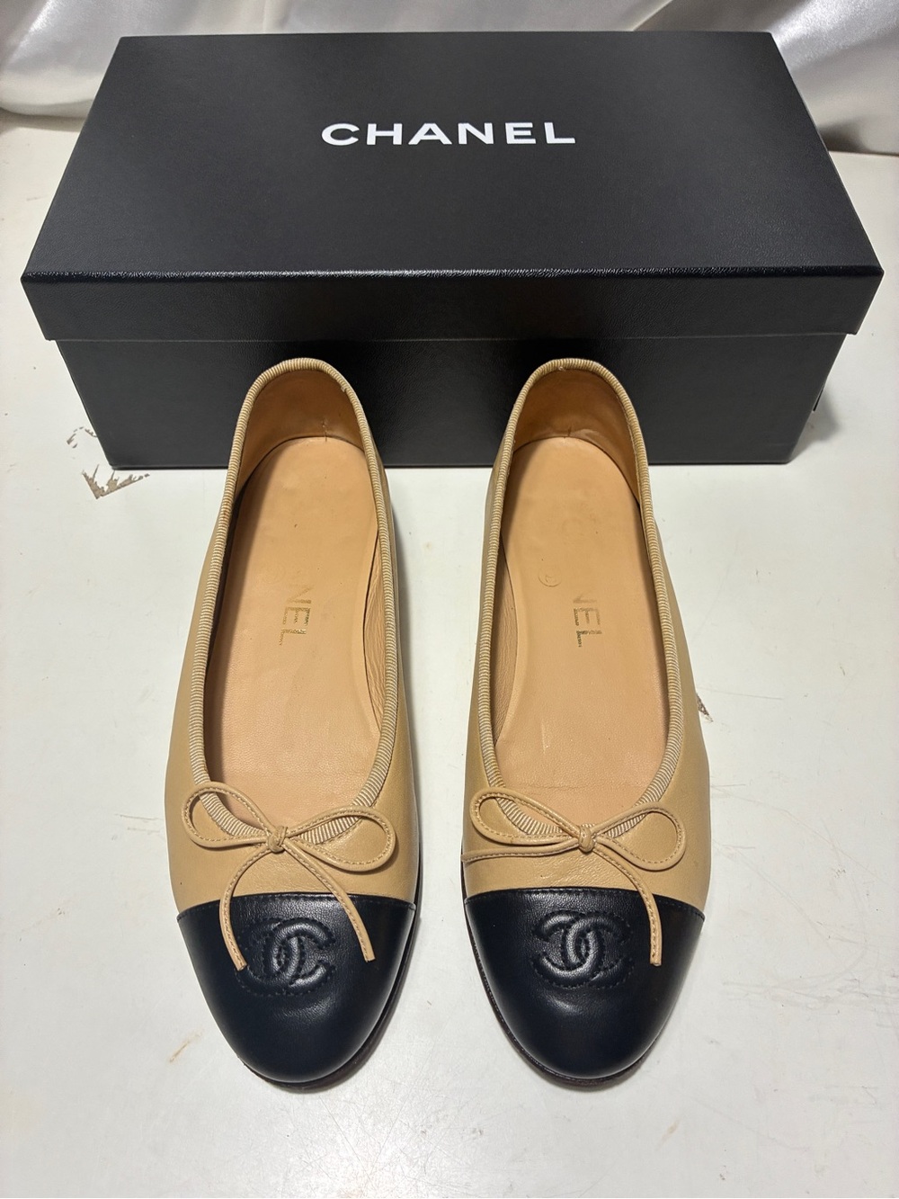 CHANEL Beige Leather Ballet Flats with Black Cap Toe
